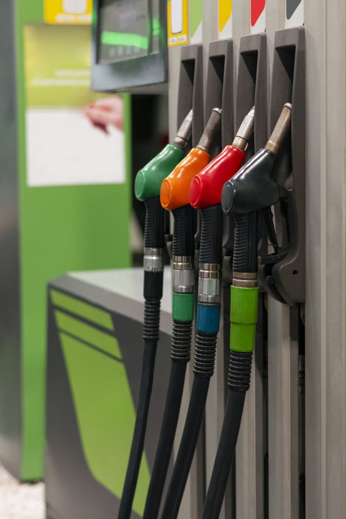 different colours gas station pumps